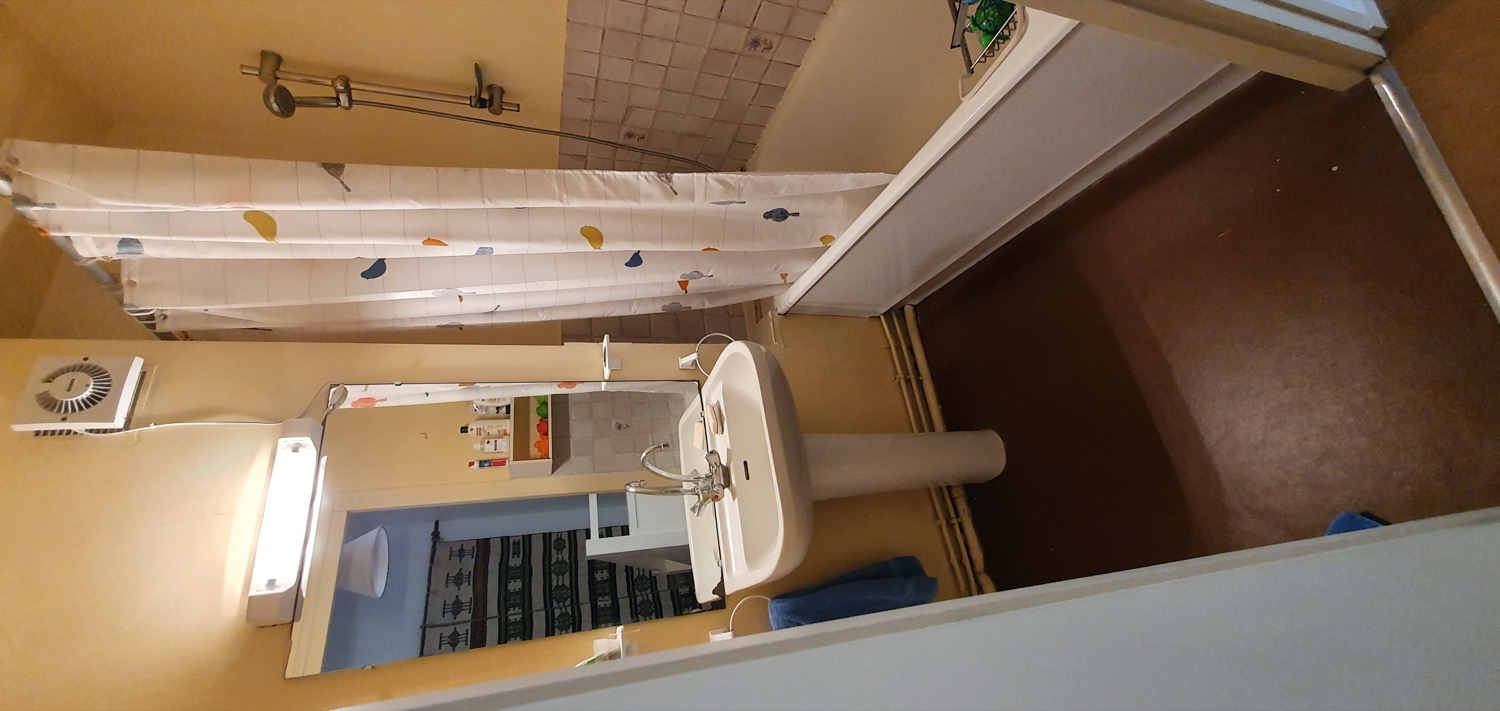 The bathroom in B27, with a shower over the bath