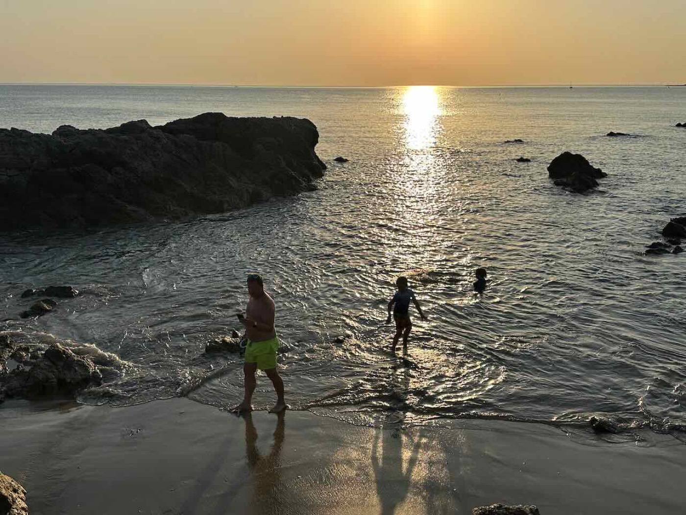 Paddling in a rocky cove at sunset